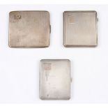A lot to include three silver cigarette cases, the first having overall machined wave design with