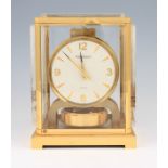 A Jaeger LeCoultre Atmos clock, the case having lucite Japanese themed design side panels with white