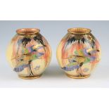A pair of Art Deco Carlton Ware vases in Sketching Bird design, both of spherical form with hand