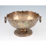 A silver twin handled rose bowl, the circular body having applied leaf design border with undulating