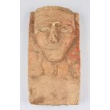 A near Eastern Arabian limestone carved stele decorative plaque with craved stylised head to upper