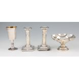 A lot to include a pair of weighted silver dwarf column candle sticks with bows and swags design (