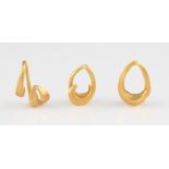 A collection of three Bronze Age gold hair rings, circa 1000 - 500 BC, each of tear drop loop form