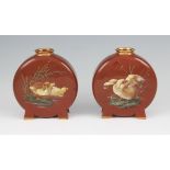 A pair of aesthetic Minton's earthenware moon flask vases decorated with hand painted duckling