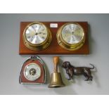 A lot to include two barometers, a brass bell and a bronze finish dog figurine.