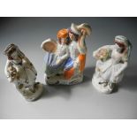 Three Staffordshire figures.