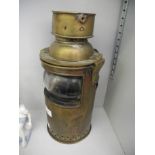 A brass E G&S 1918 oil lamp.