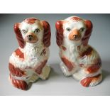 A pair of Staffordshire style springer spaniels.