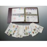 An FDC stamp album and bag of loose FDCs.