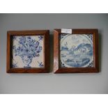 Two oak framed English Delf blue and white tiles.