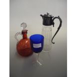 A mixture of glassware to a include ruby glass decanter.