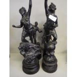 Four spelter figurines.