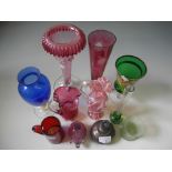 A selection of various coloured glassware.