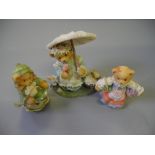 A collection of 'Cherished Teddies' together with mahogany display case.