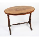 A Victorian oval walnut veneered occasional table with inlaid top, raised on turned supports with