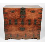 A 19th Century elm campaign trunk having patterned brass mounts, handles, hinges and central