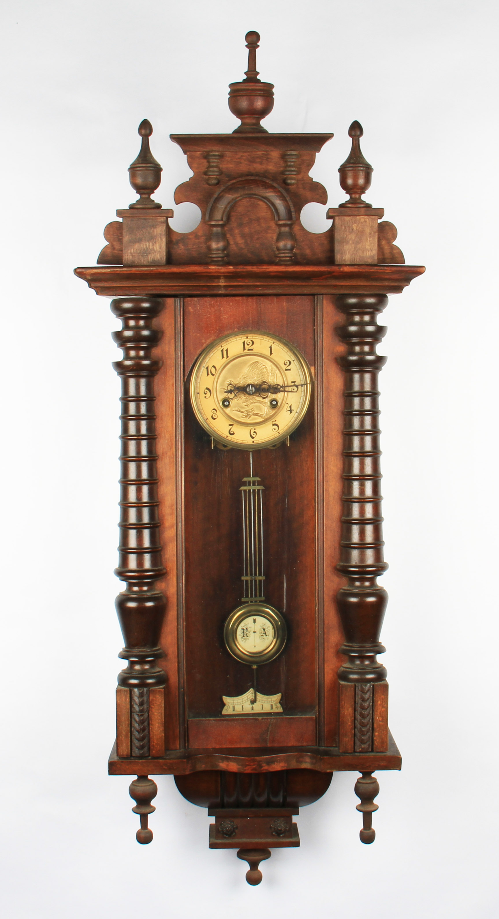 A Victorian mahogany cased hanging wall clock with brass coloured dial having Arabic numeral markers