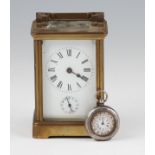 An early 20th Century brass carriage clock with black Roman numeral hourly markers with minute track