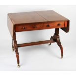 A Victorian mahogany sofa table with two fitted drawers and two false drawers on twist pillars and