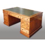 A 19th Century mahogany partners desk, top section fitted with green leather top with large