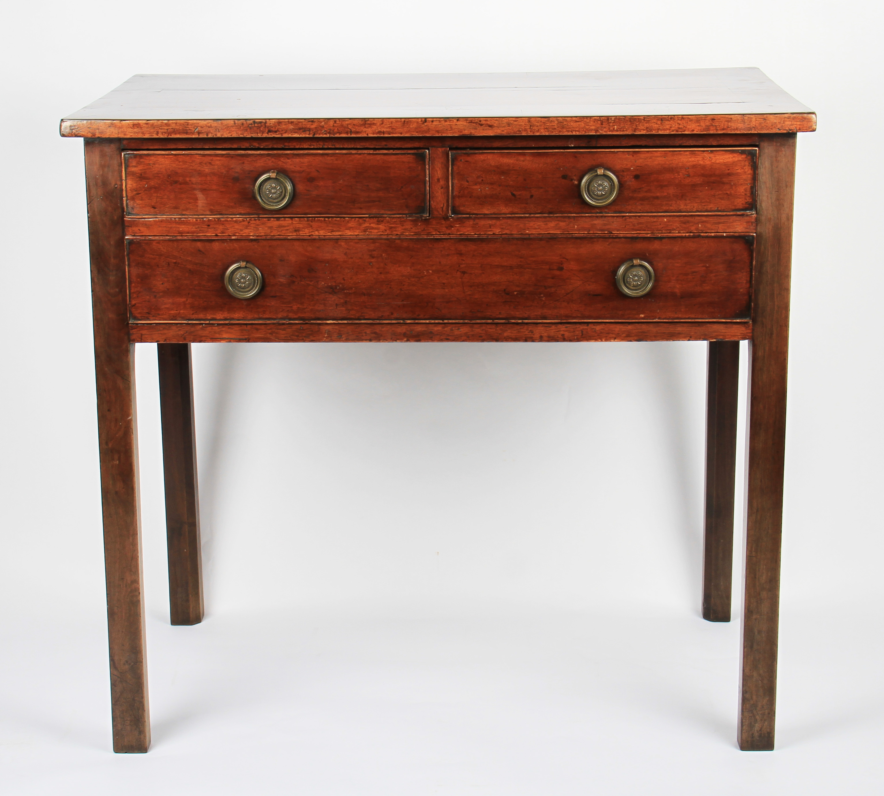 A 19th Century mahogany low boy having two short over one long drawer, each having circular brass