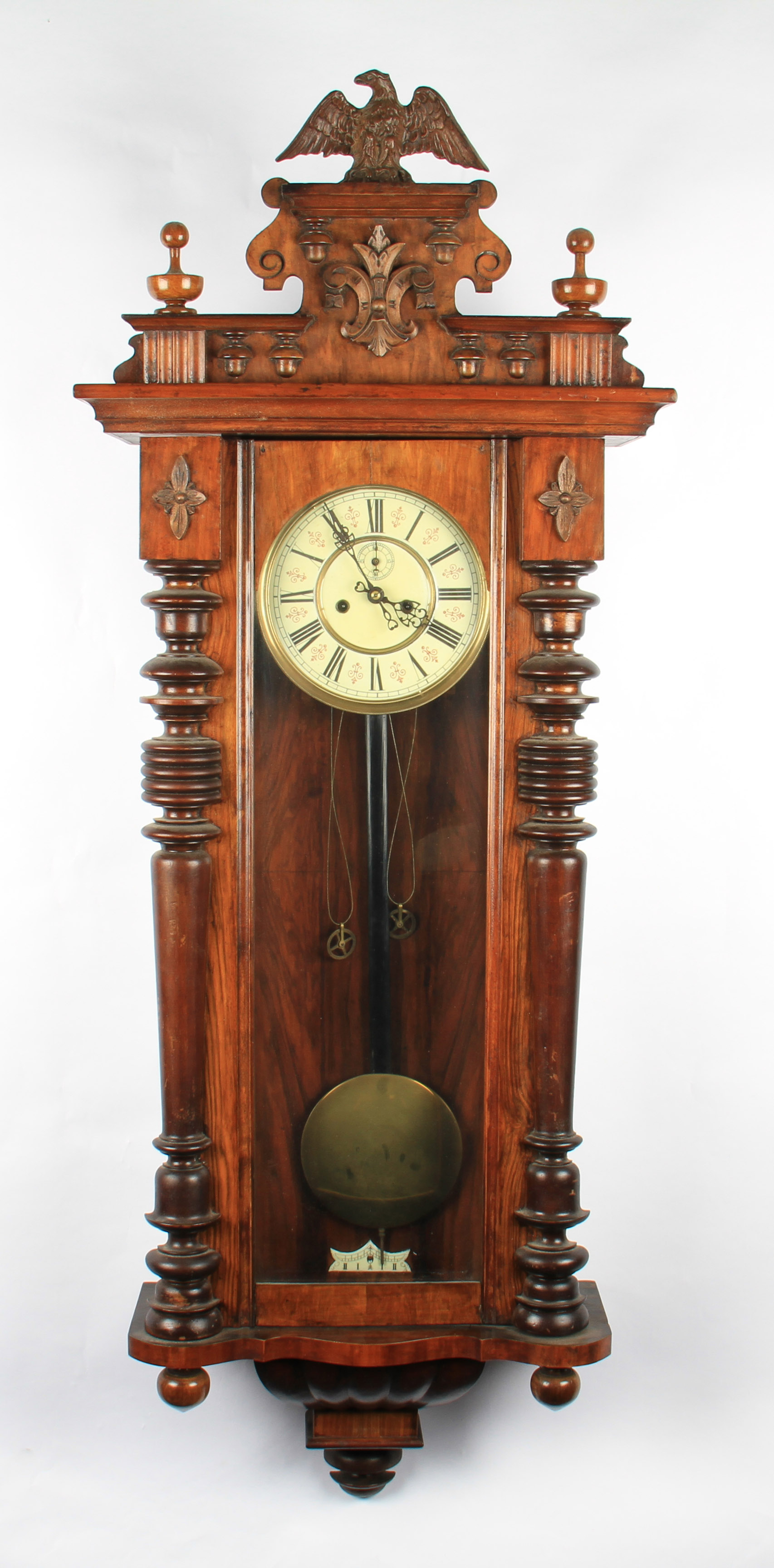 A Victorian mahogany Vienna hanging wall clock with patterned dial with black Roman numeral hourly