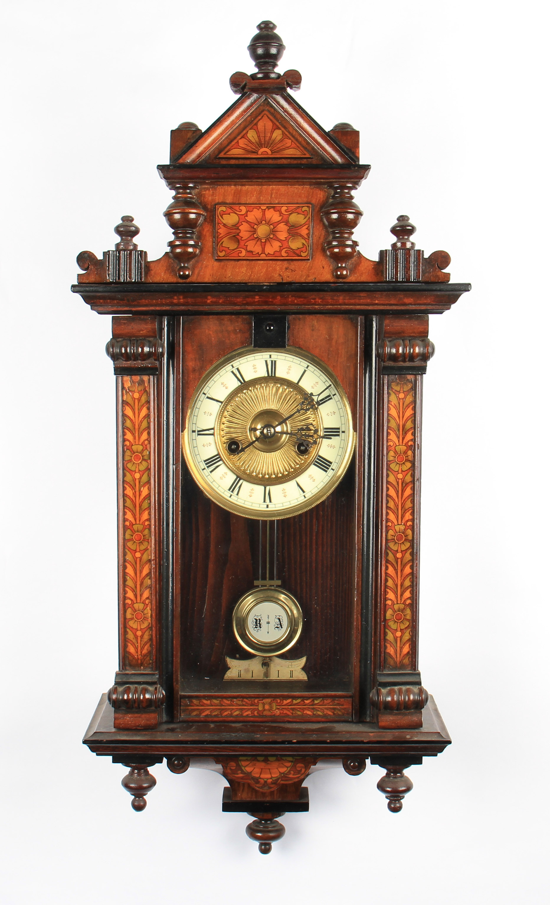 A Victorian mahogany floral inlaid hanging wall clock with brass face dial with white enamel chapter