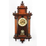 A Victorian mahogany floral inlaid hanging wall clock with brass face dial with white enamel chapter