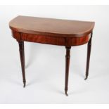 A 19th Century mahogany veneered D end shaped fold over table on turned supports.