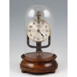 An early 20th Century 800 day magnetic clock, on circular turned mahogany stand with domed glass