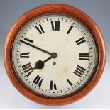 A Victorian circular oak hanging wall clock with fusee movement with white enamel dial having