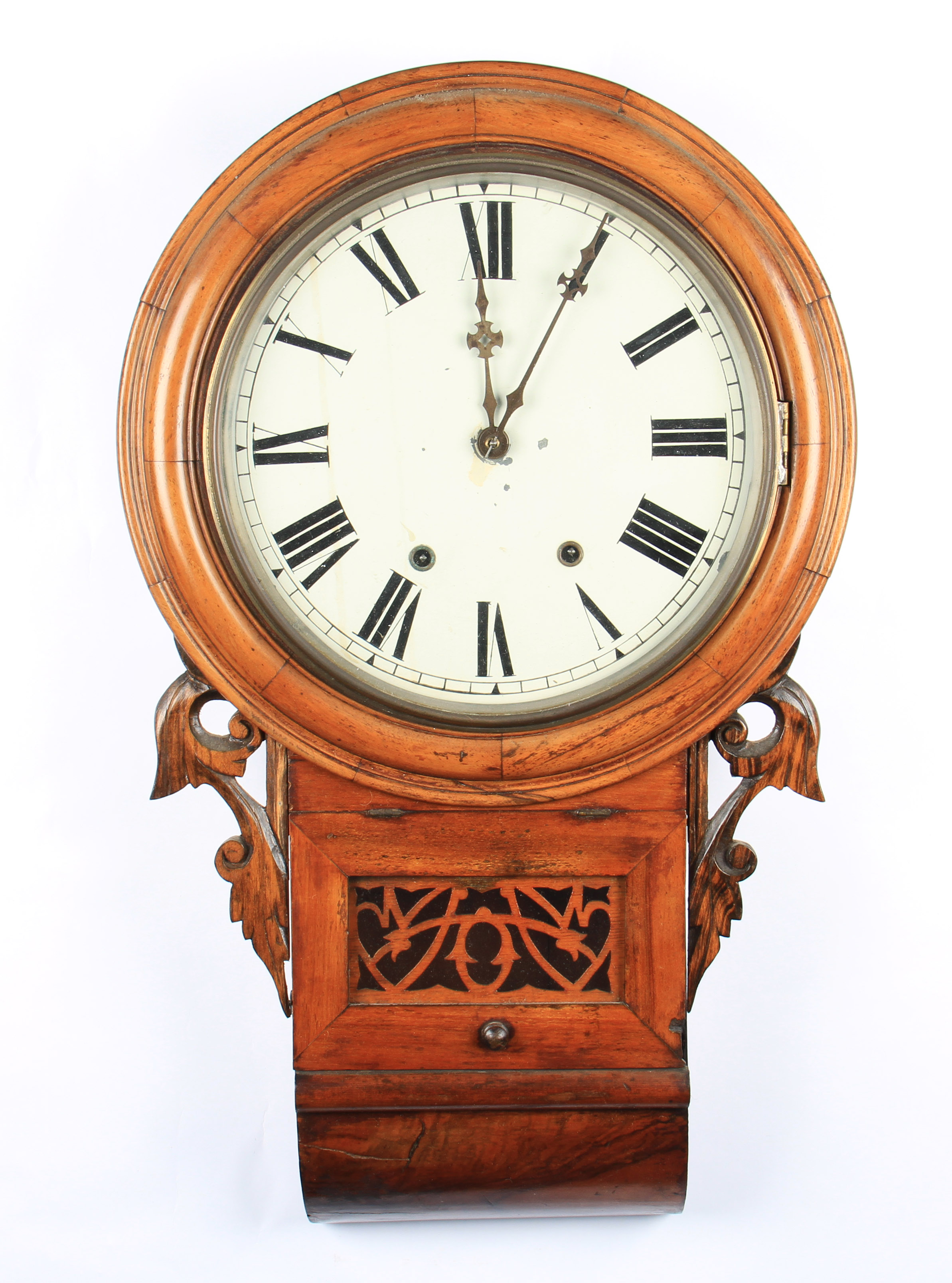 A Victorian mahogany American style hanging wall clock with carved sides and front window, the white
