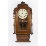 A 19th Century walnut wall clock having carved scroll decoration borders with two carved pillar
