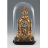 A 19th Century French ormolu mantel clock of ornate design having central figural design porcelain