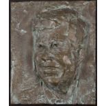 A 20th Century bronze plaque depicting shoulder length profile of John F Kennedy, stamped to lower