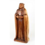 A 20th Century carved wooden sycamore sculpture depicting a standing Christ, wear a robe with arms