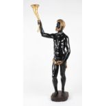 A 20th Century wooden carved Blackamoor figure of a standing male holding a cornucopia cone, with