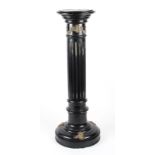 A 19th Century French ebonised black column stand with applied brass ornate detailing decoration