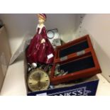 A box of assorted jewellery, Swiss eight alarm clock and painted hollow ceramic doll.