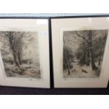 Two framed and glazed engravings of countryside landscapes.