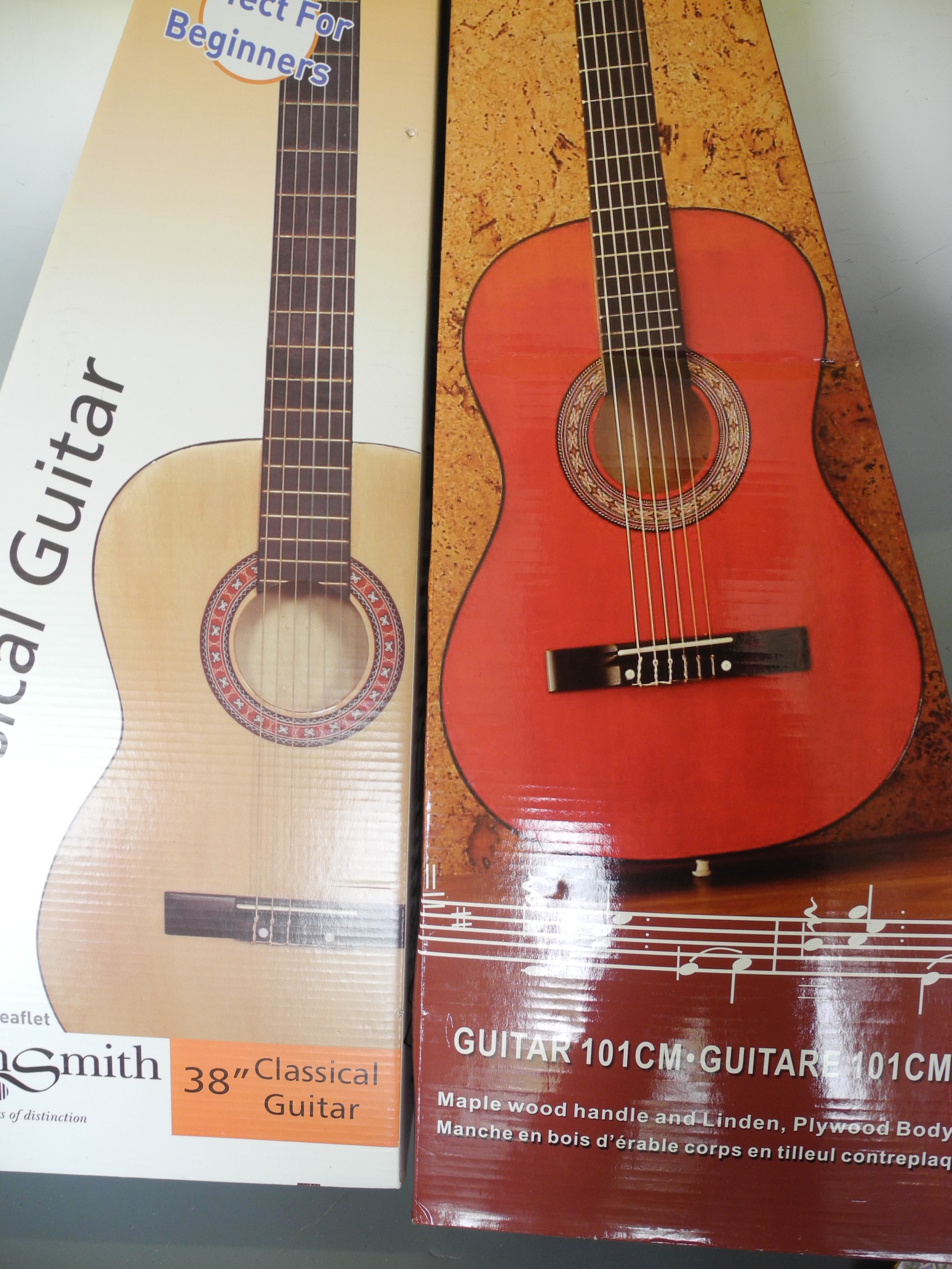 Two boxed classical guitars.