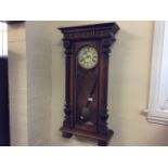 A mahogany Neo-Classical wall mounted clock with pendulum and decorated Ivory clock face (AF)