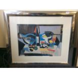 A large metal framed cubist still life print.