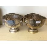 A pair of detailed classical metal memorial trophies.