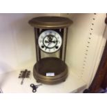 A brass framed mantle clock.