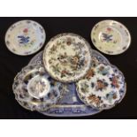 Lot to include a selection of ceramic plates and a blue and white ceramic dish.