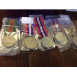 A collection of WWII military medals to include; eight ware medals, including two named examples,