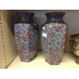 A pair of oriental vases with floral firebird pattern. Marked Kang-He.