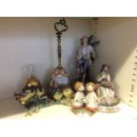 Lot to include a selection of Capodimonte figurines such as choirboys, birds, a seated lady and a