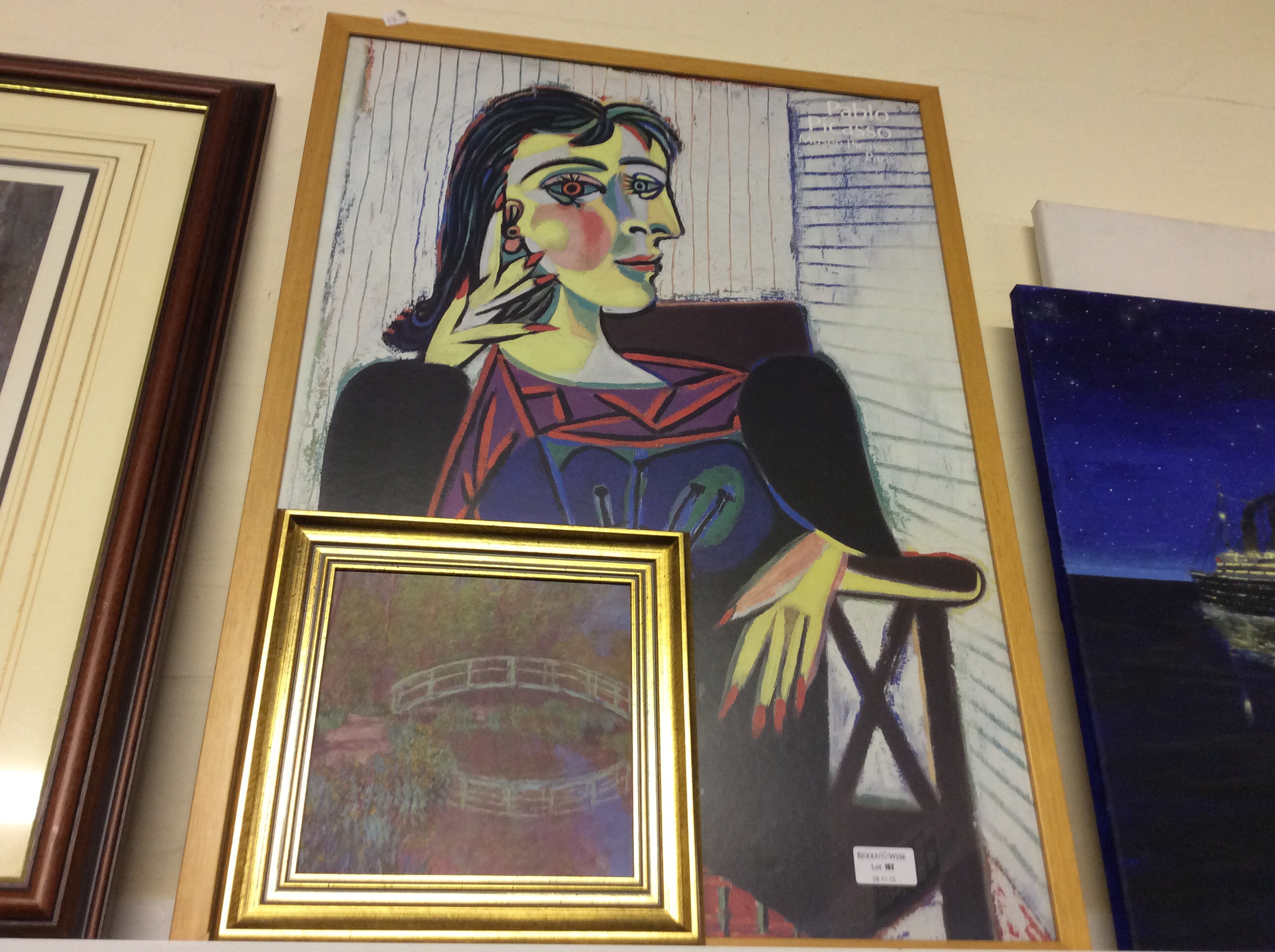 A framed Picasso print from the Musee Picasso, Paris and a gilt framed print of la Pont Jaonaise
